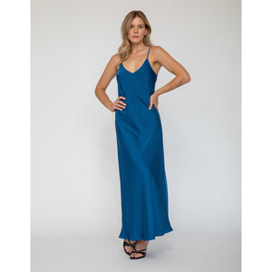 Model wearing Quyenn Erika Solid Sapphire Blue Slip Dress with minimalist design and adjustable straps