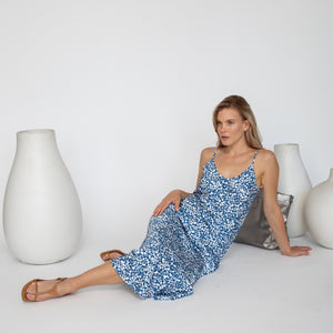 Model wearing Quyenn Breejette White & Blue Floral Slip Dress featuring soft floral print and lightweight drape
